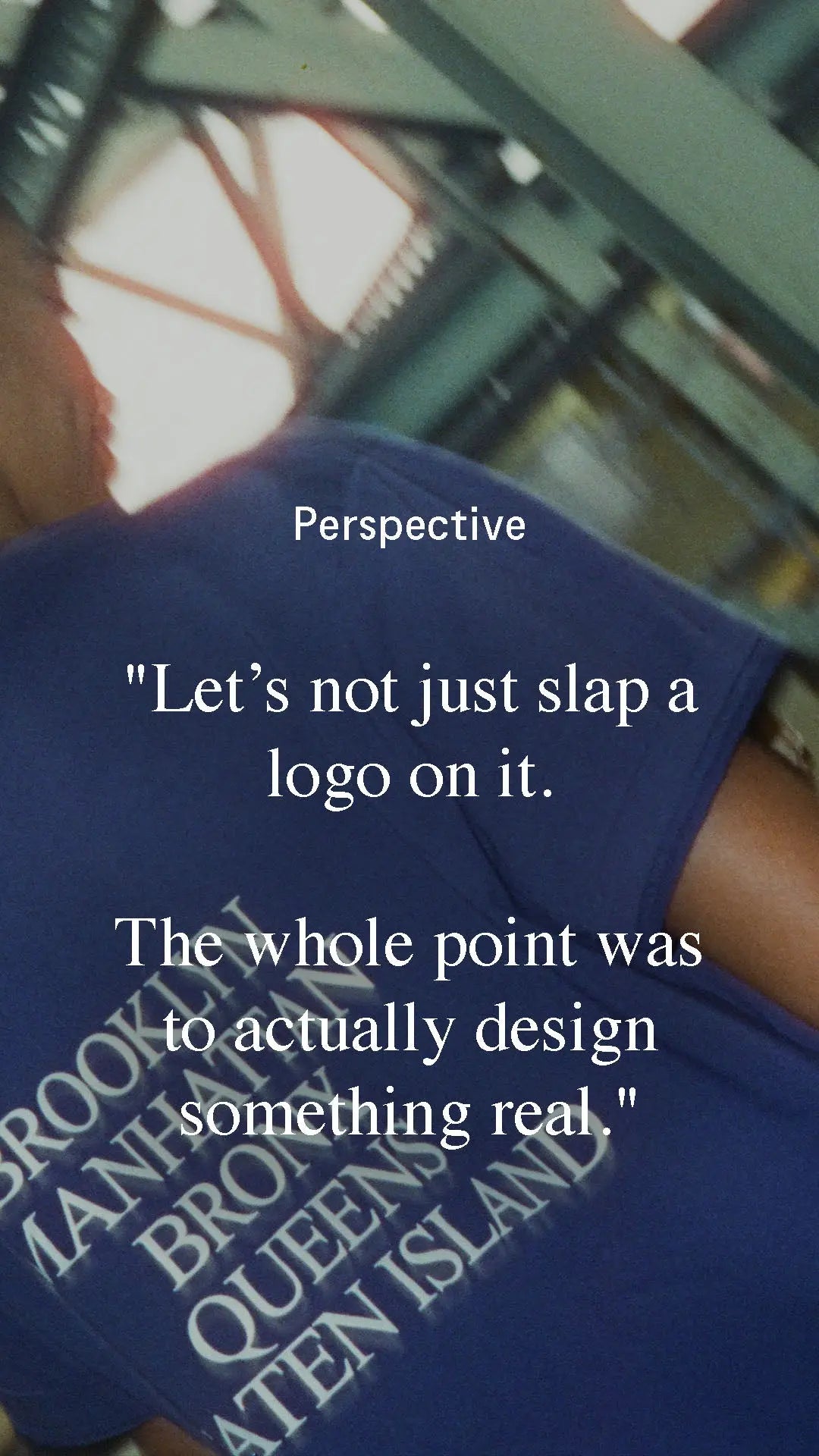 Blue shirt with text and a quote about design